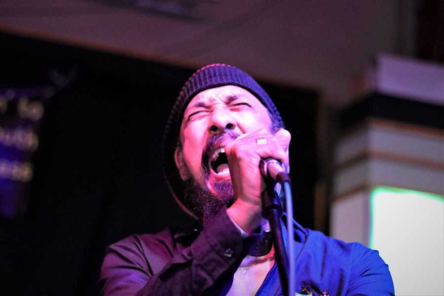 Jahmark performing live with bass guitar